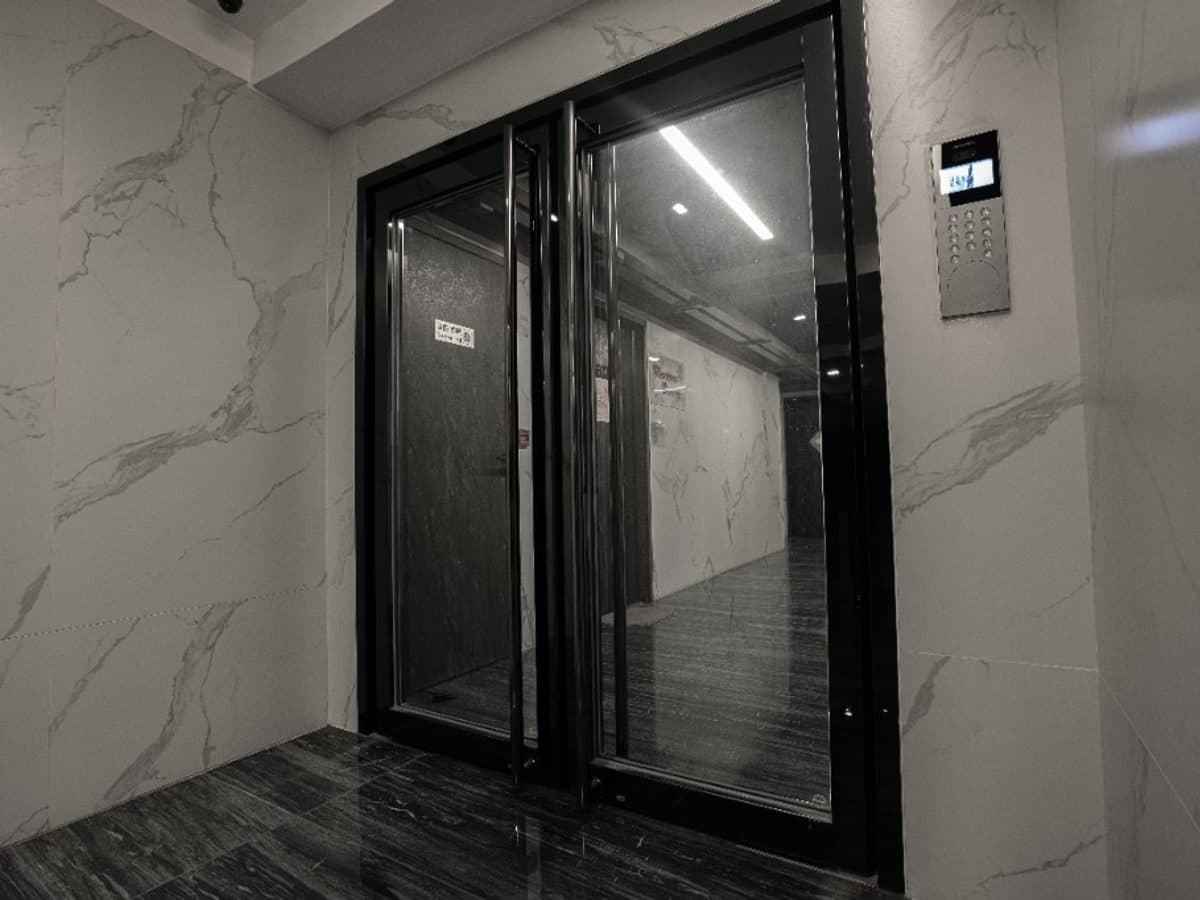 Secure glass entrance with electronic keypad